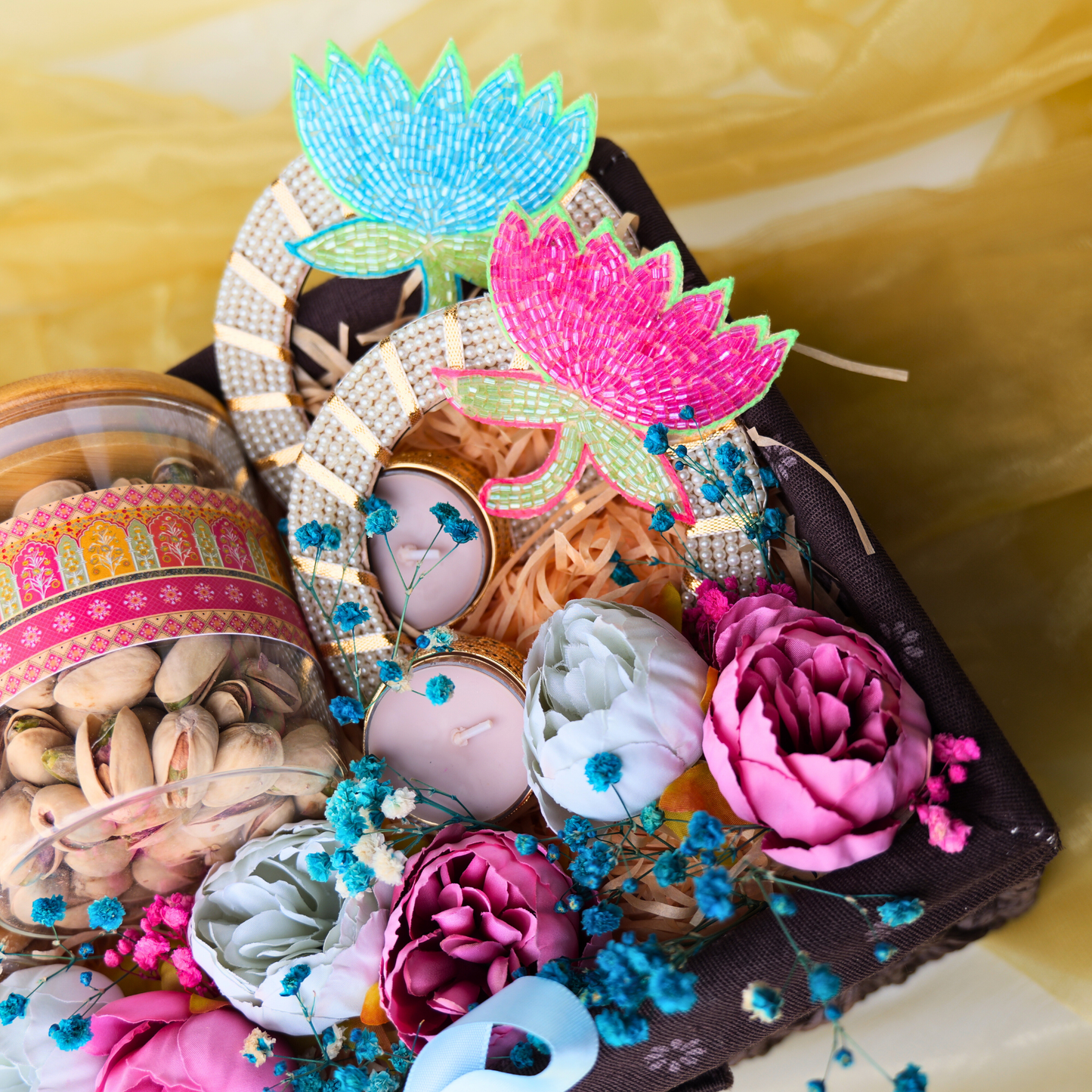 Colorful decorative items including flowers and headbands on a yellow background