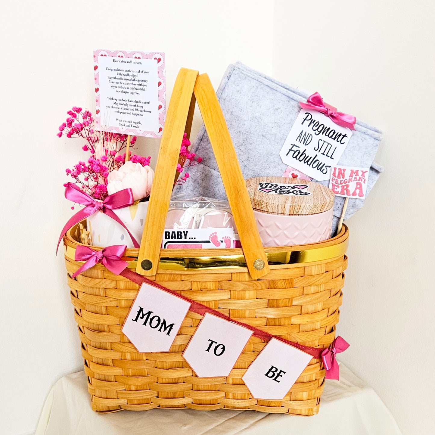 Mom To Be hamper in a gold rim picnic basket