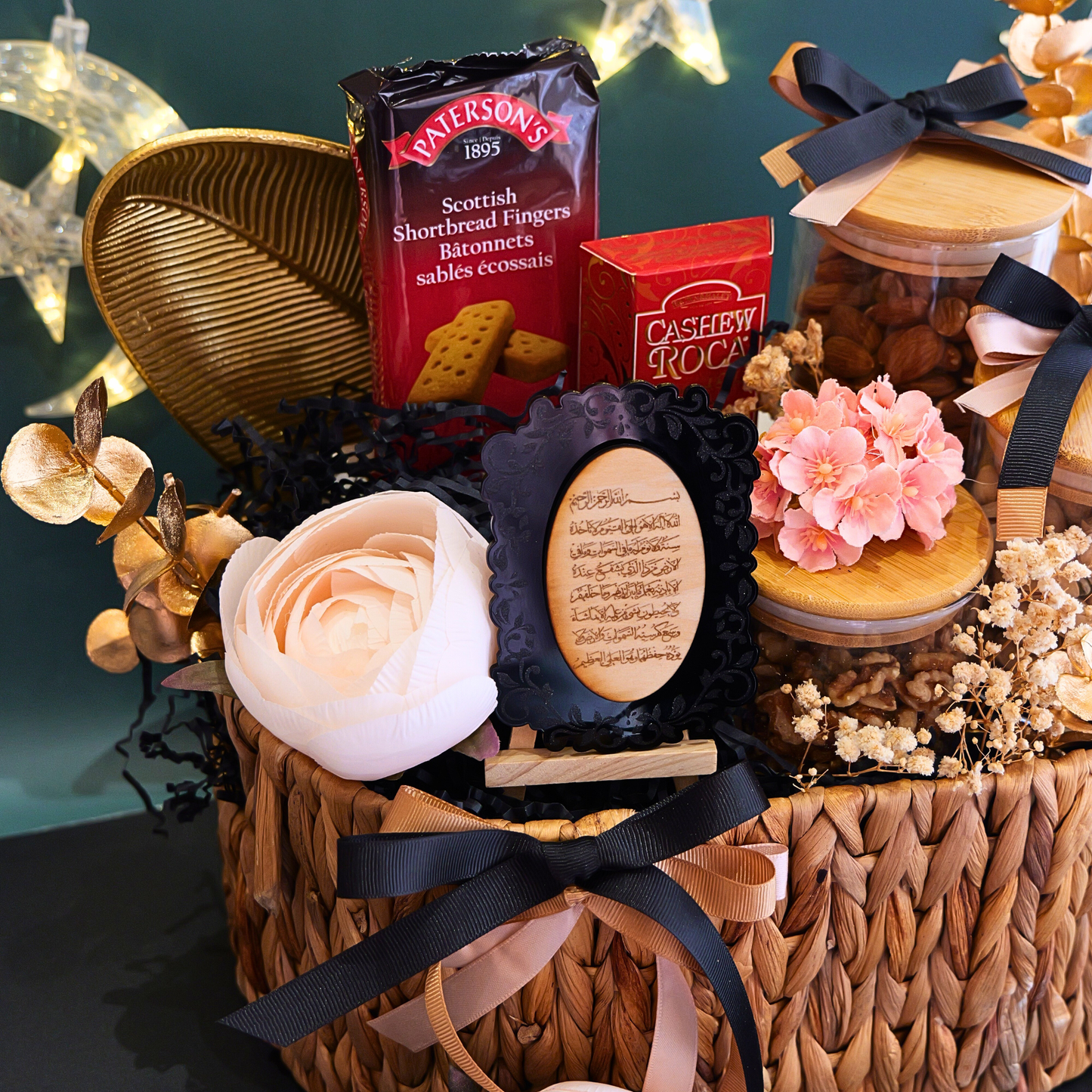 Gift basket with cookies, flowers, and decorative items on a dark background