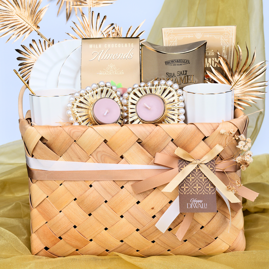 Gift basket with candles, snacks, and decorative items on a yellow background