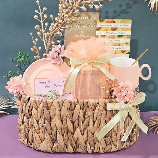 Gift basket with pink mug, soap, and flowers on a purple surface